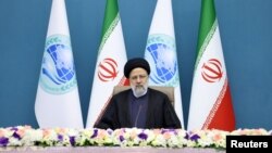 Iranian President Ebrahim Raisi attends a summit via video link at the Office of the President of Iran, in Tehran, Iran, July 4, 2023. (Iran's Presidency/WANA/Handout via Reuters)
