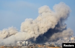 Smoke rises from Gaza following an explosion, amid the ongoing conflict between Israel and the Palestinian group Hamas, as seen from southern Israel, Nov. 15, 2023.