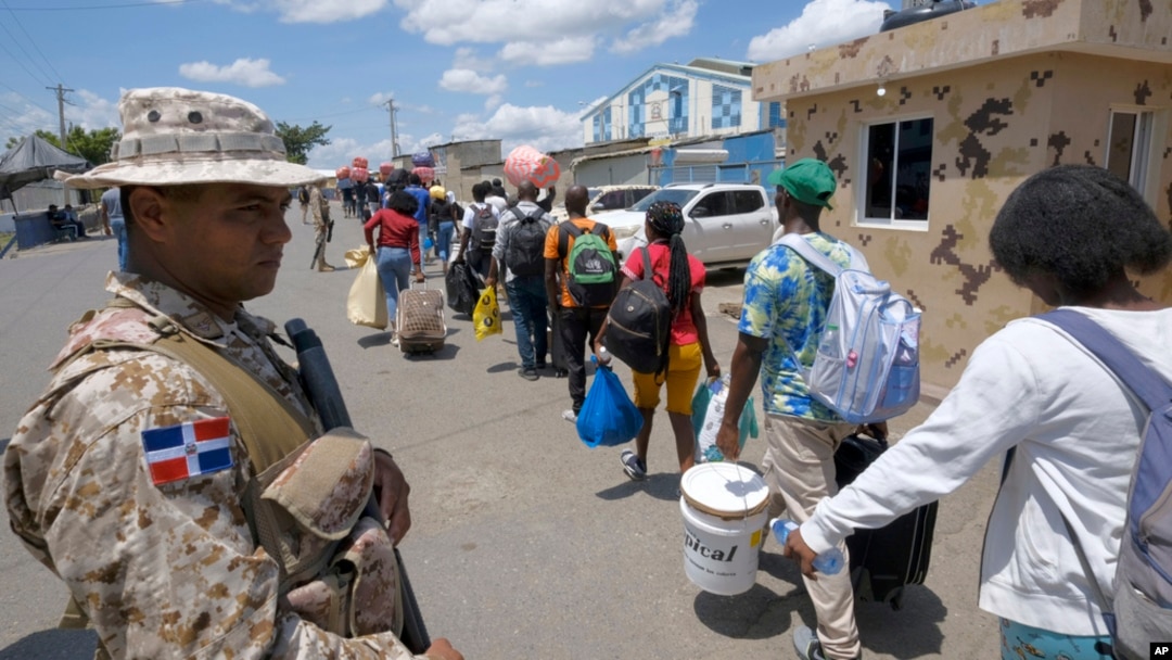 Dominican Republic security forces stand guard on a border bridge between Dajabón, Dominican Republic, and Haiti, Sept. 14, 2023.
