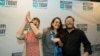 FILE - Mississippi Today reporter Anna Wolfe, center, celebrates winning the 2023 Pulitzer Prize for Local Reporting, accompanied by her mother, Bethel Wolfe, left, and father, Chris Wolfe, in Jackson, May 8, 2023.