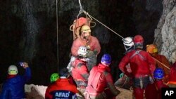 Rescuers pull American researcher Mark Dickey out of Morca Cave near Anamur, southern Turkey, Sept. 12, 2023. (Mert Gokhan Koc/Dia Images via AP) 