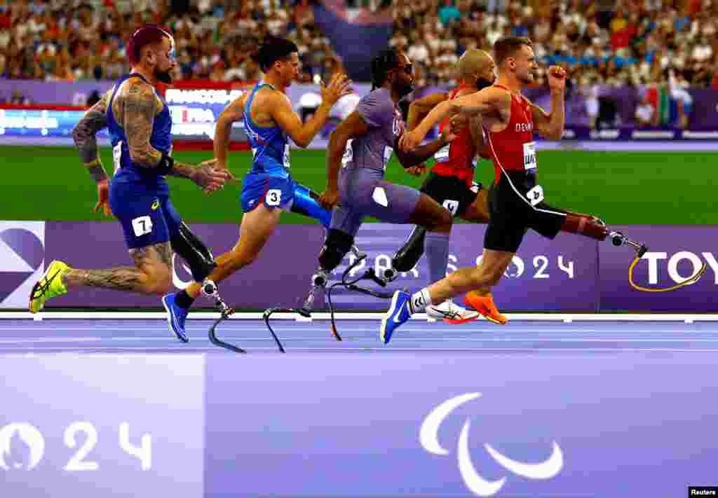 Alessandro Ossola of Italy, Leon Schaefer of Germany Desmond Jackson of United States, Daniel Wagner of Denmark and Vinicius Goncalves Rodrigues of Brazil&nbsp;compete in the athletics men&#39;s 100m T63 round 1 at the Stade de France, during the Paris 2024 Paralympics, Sept. 1, 2024.