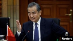 FILE - Chinese foreign minister Wang Yi gestures as he speaks during a bilateral meeting with Indonesian foreign minister Retno Marsudi in Jakarta, Indonesia, April 18, 2024. 