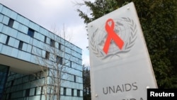 FILE - A logo is seen near the headquarters of the UNAIDS in Geneva, Switzerland, Feb. 2, 2023.