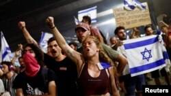 Protesters block Ayalon Highway during a demonstration following a parliament vote on a contested bill that limits Supreme Court powers to void some government decisions, in Tel Aviv, July 25, 2023. 