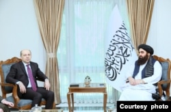 Taliban Foreign Minister Amir Khan Muttaqi, right, and Russian Ambassador Dmitry Zhirnov meet in Kabul on Feb. 14, 2024, to discuss the Qatar meeting to be held Sunday. (Courtesy Taliban Foreign Ministry)