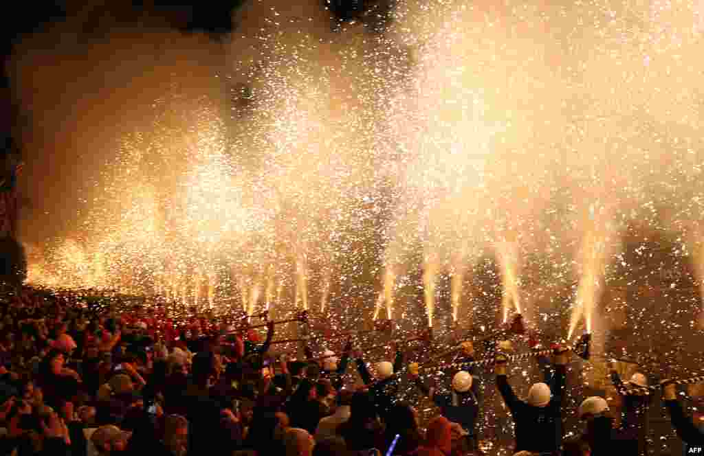 Revelers take part in the procession through the town during the Bridgwater Guy Fawkes Carnival in south-west England, Nov. 4, 2023.