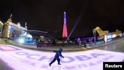 FILE - A child skates at the opening of an ice rink at the Exhibition of Achievements of the National Economy in Moscow, Russia, Nov. 24, 2023. Despite sanctions, Russia's economy outpaced both the U.S. and Europe in terms of growth in 2023.