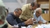 Electoral staff count ballots in Tehran, Iran, after voting ended in a snap presidential election to choose a successor to Ebrahim Raisi following his death in a helicopter crash, June 29, 2024. (Majid Asgaripour/West Asia News Agency via Reuters)