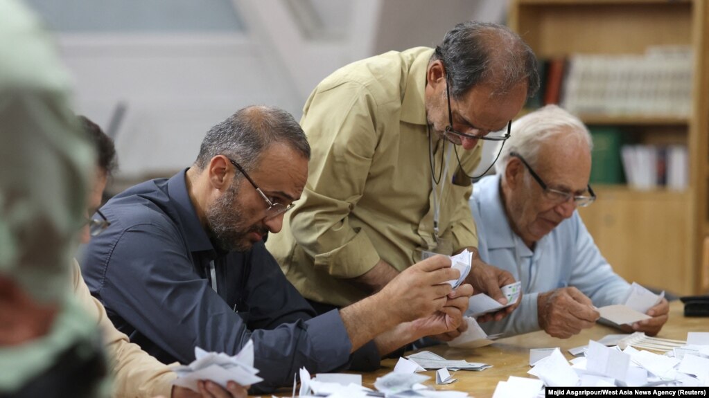 Electoral staff count ballots in Tehran, Iran, after voting ended in a snap presidential election to choose a successor to Ebrahim Raisi following his death in a helicopter crash, June 29, 2024. (Majid Asgaripour/West Asia News Agency via Reuters)
