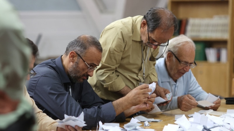 Iran election heads to runoff; turnout numbers in dispute