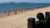 (FILE) A child looks on towards China's Xiamen city from the coast in Kinmen, Taiwan.
