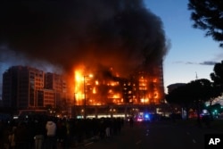 A housing block burns in Valencia, Spain, Feb. 22, 2024.