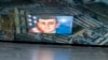 FILE - This photo illustration created April 13, 2023, shows the suspected intelligence leaker, Air National Guardsman Jack Teixeira, reflected in an image of the Pentagon in Arlington, Virginia.