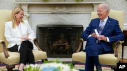 President Joe Biden meets with Italian Prime Minister Giorgia Meloni in the Oval Office of the White House, July 27, 2023, in Washington.