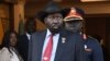 FILE - South Sudan's President Salva Kiir, center, stands at the Presidential Palace in Juba, South Sudan, on Feb. 3, 2023.