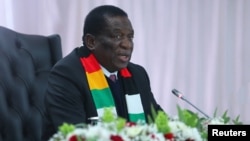 Zimbabwean President Emmerson Mnangagwa attends a joint press conference with Iran's President Ebrahim Raisi (not pictured) at the State House in Harare, Zimbabwe, July 13, 2023. (West Asia News Agency Handout via Reuters)