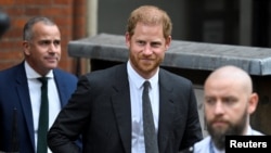 FILE - Britain's Prince Harry walks outside the High Court, in London, March 30, 2023. 