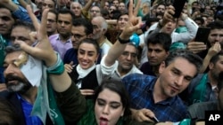 Supporters of reformist candidate for Iran's presidential election Masoud Pezeshkian attend his campaign meeting in Tehran, Iran, June 23, 2024.