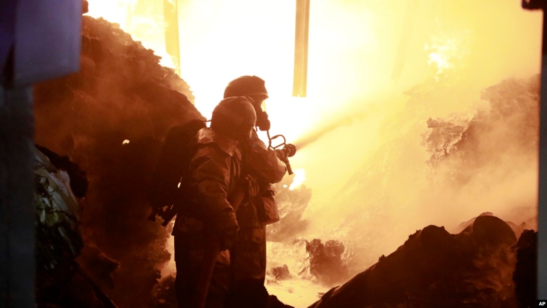 Firefighters put out a fire caused by an explosion at an industrial building in Nairobi, Kenya, Feb. 2, 2024.