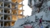 Palestinians inspect the damage after an Israeli bombardment on east of Deir al-Balah, Aug. 29, 2024. 