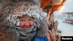 Vendor Nyurgusun Starostina, 47, poses for a picture at an open-air market on a frosty day in Yakutsk, Russia.&nbsp;Temperatures in parts of the Sakha Republic, also known as Yakutia and located in the northeastern part of Siberia, went below - 50&deg;&nbsp;C (- 58&deg; F).