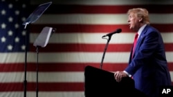 FILE - Former President Donald Trump speaks during a rally in Reno, Nevada, Dec. 17, 2023. On Dec. 19, the Colorado Supreme Court declared Trump ineligible for the White House under the U.S. Constitution’s insurrection clause.
