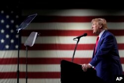 Mantan Presiden Donald Trump dalam rapat umum di Reno, Nevada, Minggu, 17 Desember 2023. (AP/Godofredo A. Vásquez, File)