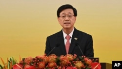 FILE- Hong Kong's Chief Executive John Lee gives a speech following a swearing-in ceremony to inaugurate the city's new government in Hong Kong on July 1, 2022. 
