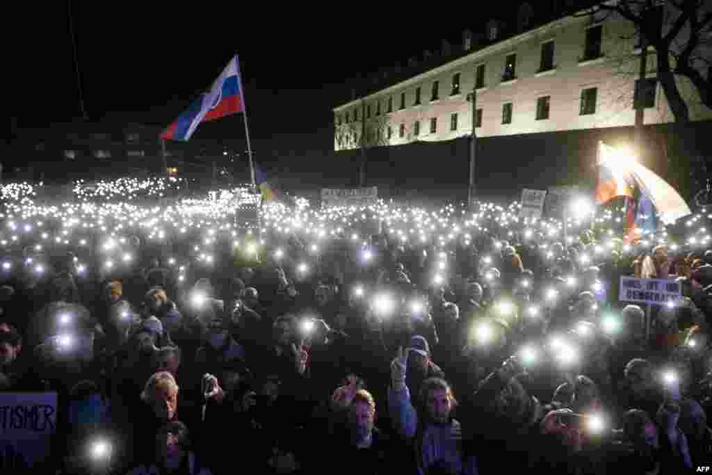 People take part in a demonstration to protest criminal code reforms to be passed despite sharp criticism from the EU, in front of the Slovak parliament in Bratislava, Slovakia.&nbsp;The changes, which prompted a wave of anti-government protests, include easing the penalties for corruption and economic offences.