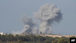 Smoke rises following an Israeli bombardment in the Gaza Strip, as seen from southern Israel on Dec. 4, 2023.