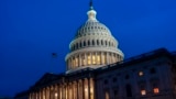 FILE - The lights are on at the US Capitol in Washington on late Feb. 9, 2024, as the Senate settles in for a rare weekend session to work on a package of wartime funding for Ukraine, Israel and other US allies.