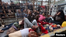 Wounded Palestinians are transported to Nasser Hospital, following Israeli strikes, amid the ongoing conflict between Israel and the Palestinian Islamist group Hamas, in Khan Younis, in the southern Gaza Strip, Dec. 5, 2023.