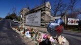 A balloon with names of the victims is seen at a memorial at the entrance to The Covenant School on March 29, 2023, in Nashville, Tennessee.