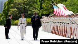 US Secretary of Defense Lloyd Austin and Japanese Defense Minister Yasukazu Hamada review the guard of honor at the Defense Ministry in Tokyo, Japan.