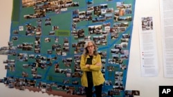 Judy Branfman stands by a map she created as part of a gallery installation at Beyond Baroque Gallery on Nov. 3, 2023, in the Venice Beach area of Los Angeles. (AP Photo/Richard Vogel)