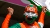 An Indian supporter cheers for his team ahead of the ICC Men's T20 World Cup cricket match between Afghanistan and India at Kensington Oval in Bridgetown, Barbados, June 20, 2024.