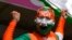 An Indian supporter cheers for his team ahead of the ICC Men's T20 World Cup cricket match between Afghanistan and India at Kensington Oval in Bridgetown, Barbados, June 20, 2024.