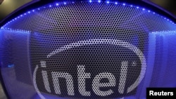 FILE PHOTO: Computer chip maker Intel's logo is shown on a display during the opening day of E3, the annual video games expo in Los Angeles, June 11, 2019. 