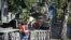 FILE - Workers remove a Soviet T-34 tank installed as a monument in Narva, Estonia, Aug. 16, 2022. Russia's invasion of Ukraine has led to a renewed push to topple the last remaining monuments to the Soviet army that remained in Europe. 