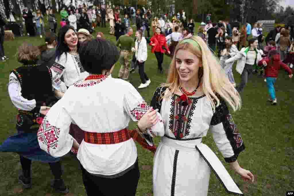 People dance during the Orthodox Easter celebrations in the western Ukrainian city of Lviv amid the Russian invasion of Ukraine.