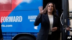 Democratic presidential nominee Vice President Kamala Harris waves as she exits her campaign bus in Savannah, Georgia, Aug. 28, 2024. On Thursday she and her running mate, Minnesota Governor Tim Walz, sat for their first major television interview of their presidential campaign.