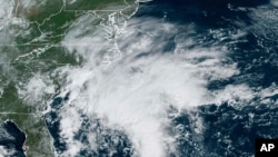 This Sept. 21, 2023, satellite image provided by the National Oceanic and Atmospheric Administration shows a potential tropical cyclone forming off the southeastern coast of the United States in the Atlantic Ocean.