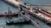 一艘美国俄亥俄级制导导弹核动力舰艇（船舷号The USS Michigan[密西根]号2023年6月16日）抵达韩国东南港口城市釜山。