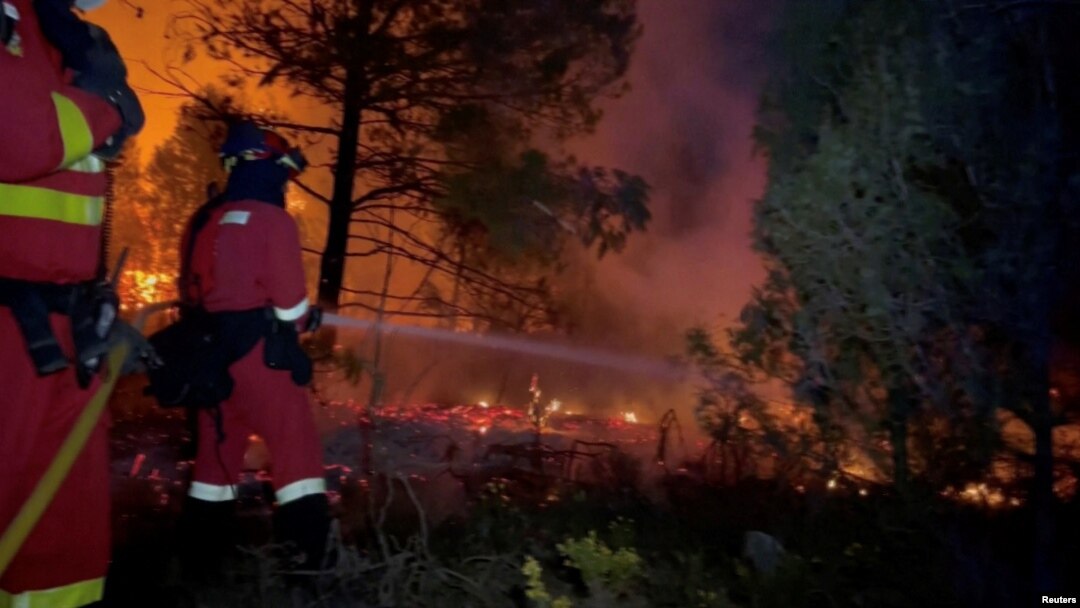 Military Emergency Unit firefighters battle flames from the Villanueva de Viver wildfire, Spain, March 23, 2023. (Military Emergency Unit/Handout via Reuters).