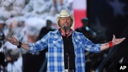 FILE - In this April 7, 2014, file photo, Toby Keith performs in Las Vegas. The singer-songwriter died at 62. Keith passed peacefully Feb. 5, 2024, surrounded by his family, according to a statement posted on Keith's website.