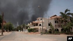 FILE - Smoke is seen rising from a neighborhood in Khartoum, Sudan, April 15, 2023. Fierce clashes between Sudan’s military and the country’s paramilitary erupted in the capital. The fighting raised fears of a wider conflict in the chaos-stricken nation. 