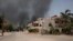 FILE - Smoke is seen rising from a neighborhood in Khartoum, Sudan, April 15, 2023. Fierce clashes between Sudan’s military and the country’s paramilitary erupted in the capital. The fighting raised fears of a wider conflict in the chaos-stricken nation. 
