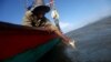 Fisherman Ung Bun, 39, releases female crabs with eggs back to sea as part of the government campaign to save the declining crabs in Angkoal village at the coast of Cambodia's southern Kep province, Cambodia August 18, 2023. (REUTERS/Thomas Suen)