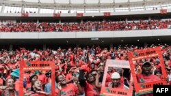 Economic Freedom Fighters (EFF) supporters cheer as EFF leader Julius Malema (unseen) does a walkabout during the EFF manifesto launch at the Moses Mabhida stadium in Durban on Saturday, February 10, 2024.